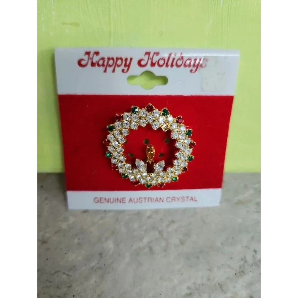 holiday wreath and candle with lots of crystals brooch
